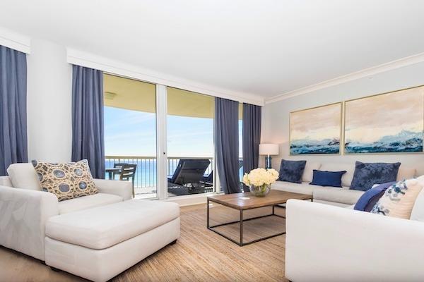 Beachfront living room in a three-bedroom condo at Silver Shells Beach Resort and Spa in Destin, Florida.